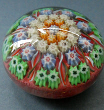 Load image into Gallery viewer,  VASART Scottish Glass Paperweight with 9 Spokes; with rose pink ground, latticino canes &amp; millefiori rosette
