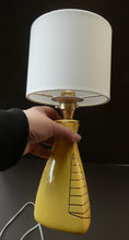 Load image into Gallery viewer, Vintage 1950s Pottery Table Lamp with White Drum Shade. Yellow Triangular Shape with Gold Decoration
