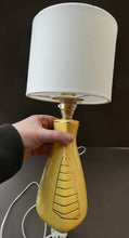 Load image into Gallery viewer, Vintage 1950s Pottery Table Lamp with White Drum Shade. Yellow Triangular Shape with Gold Decoration
