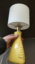 Load image into Gallery viewer, Vintage 1950s Pottery Table Lamp with White Drum Shade. Yellow Triangular Shape with Gold Decoration
