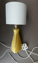 Load image into Gallery viewer, Vintage 1950s Pottery Table Lamp with White Drum Shade. Yellow Triangular Shape with Gold Decoration
