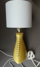 Load image into Gallery viewer, Vintage 1950s Pottery Table Lamp with White Drum Shade. Yellow Triangular Shape with Gold Decoration
