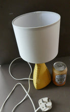 Load image into Gallery viewer, Vintage 1950s Pottery Table Lamp with White Drum Shade. Yellow Triangular Shape with Gold Decoration
