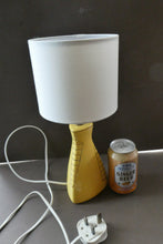 Load image into Gallery viewer, Vintage 1950s Pottery Table Lamp with White Drum Shade. Yellow Triangular Shape with Gold Decoration
