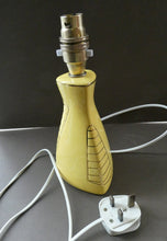 Load image into Gallery viewer, Vintage 1950s Pottery Table Lamp with White Drum Shade. Yellow Triangular Shape with Gold Decoration
