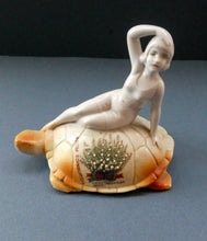 Load image into Gallery viewer, 1920s GERMAN Souvenir. Bathing Belle Riding on the Back of a Turtle. Lucky White Heather Ware Figurine EDINBURGH Location
