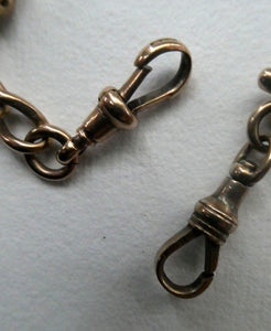 Antique 9CT Gold Double Albert Pocket Watch Chain. Length (clip end to clip end) 16 1/4 inches. Marked 9: 375