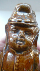 Antique Staffordshire / Scottish 19th Century Bank or Money Box with Treacle Glaze. In the form of a Little Double-Sided Man