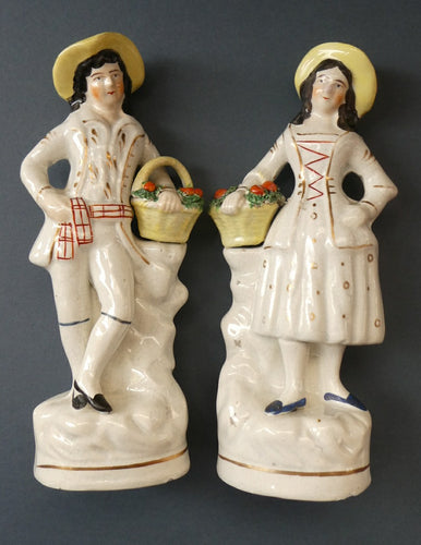 Victorian Staffordshire Figurines. Couple Harvesting and Carrying Baskets of Fruit