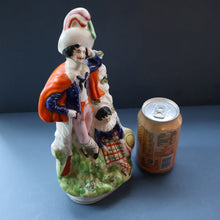 Load image into Gallery viewer, Antique STAFFORDSHIRE Figurine. Rarer Modelled Group: A Huntsman and Little Seated Girl. Excellent Condition. 10 1/4 inches high
