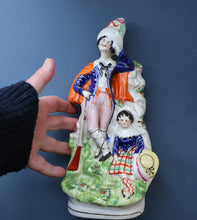 Load image into Gallery viewer, Antique STAFFORDSHIRE Figurine. Rarer Modelled Group: A Huntsman and Little Seated Girl. Excellent Condition. 10 1/4 inches high
