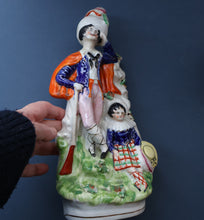 Load image into Gallery viewer, Antique STAFFORDSHIRE Figurine. Rarer Modelled Group: A Huntsman and Little Seated Girl. Excellent Condition. 10 1/4 inches high
