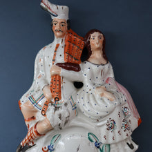 Load image into Gallery viewer, ANTIQUE Victorian Staffordshire Flatback Figurine. A Highlander and his Sweetheart Sitting on a Clock Face. Poor Man&#39;s Clock
