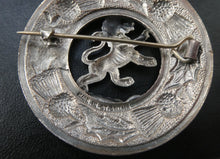 Load image into Gallery viewer, Vintage White Metal Celtic Style Brooch with Lion Rampant Motif, Thistle Motifs and Blue Enamel
