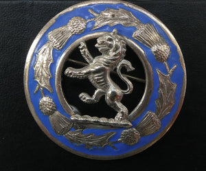 Vintage White Metal Celtic Style Brooch with Lion Rampant Motif, Thistle Motifs and Blue Enamel