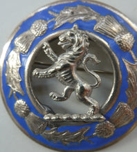 Load image into Gallery viewer, Vintage White Metal Celtic Style Brooch with Lion Rampant Motif, Thistle Motifs and Blue Enamel
