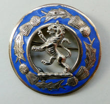 Load image into Gallery viewer, Vintage White Metal Celtic Style Brooch with Lion Rampant Motif, Thistle Motifs and Blue Enamel
