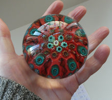 Load image into Gallery viewer, Beautiful 1950s VASART Paperweight with 9 Twisted Spokes; with a red ground
