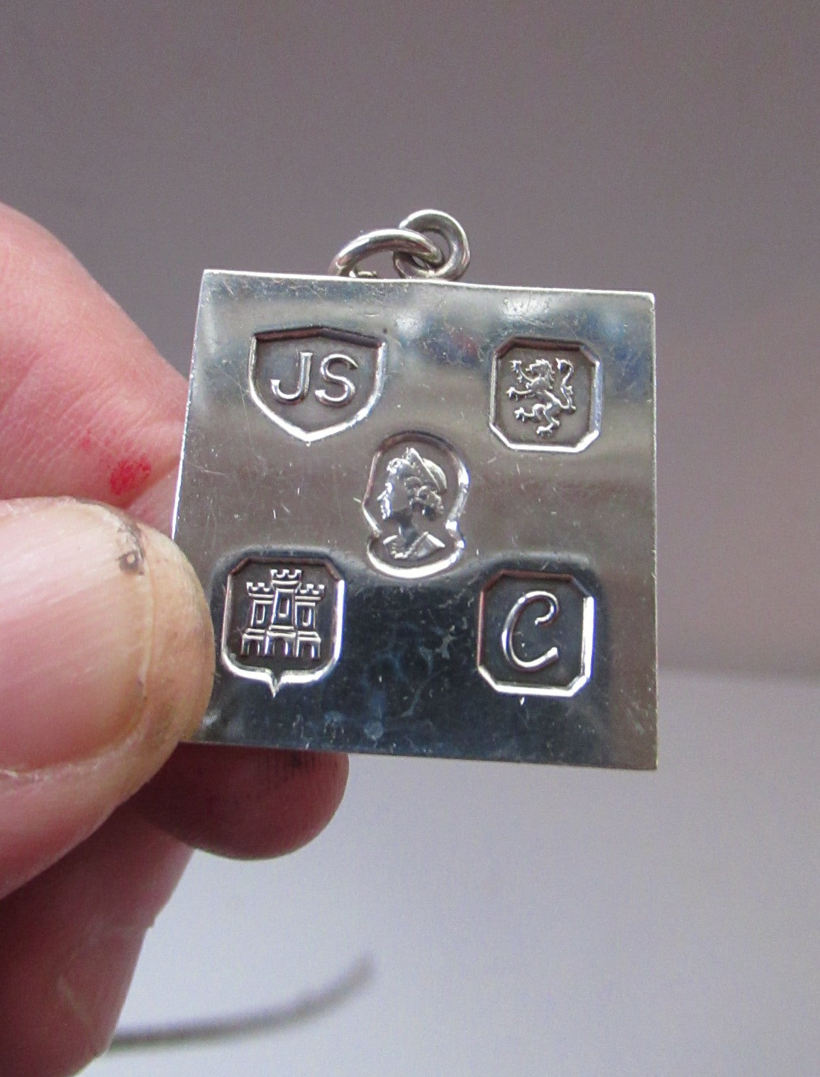 A silver ingot pendant and chain, 35g