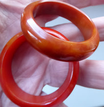 Load image into Gallery viewer, Set of Four Art Deco Bakelite Napkin Rings. Mostly Amber 1930s
