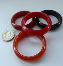 Load image into Gallery viewer, Set of Four Art Deco Bakelite Napkin Rings. Mostly Amber 1930s
