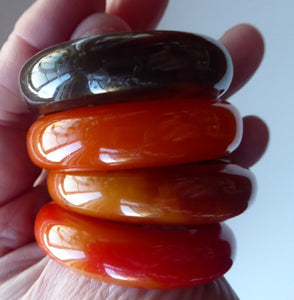 Set of Four Art Deco Bakelite Napkin Rings. Mostly Amber 1930s