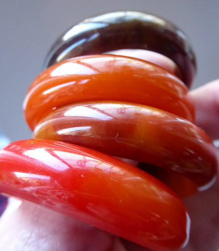 Set of Four Art Deco Bakelite Napkin Rings. Mostly Amber 1930s