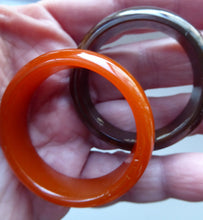 Load image into Gallery viewer, Set of Four Art Deco Bakelite Napkin Rings. Mostly Amber 1930s
