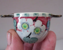 Load image into Gallery viewer, SCOTTISH POTTERY. 1920s Mak Merry Hand-Painted Miniature Quaich or Twin Handled Bowl. Pink Background with Prunus Flowers
