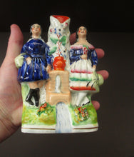 Load image into Gallery viewer, Antique Staffordshire Miniature Spill Vase. A Courting Couple Standing at a Well over a Stream
