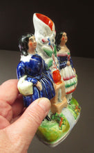 Load image into Gallery viewer, Antique Staffordshire Miniature Spill Vase. A Courting Couple Standing at a Well over a Stream
