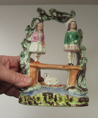 Miniature Flatback Figurine. Couple in a Bough with Swan and Bridge